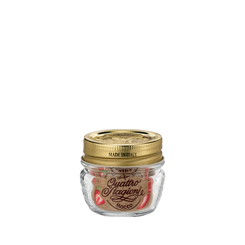 Barattolo in vetro con coperchio metallico dorato e etichetta con scritto Quattro Stagioni Rocco, contenuto non visibile, sfondo bianco.