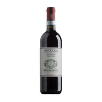 Bottiglia di vino rosso Valpolicella Superiore, etichetta chiara con ornamentazioni e dettagli verdi, tappo rosso.