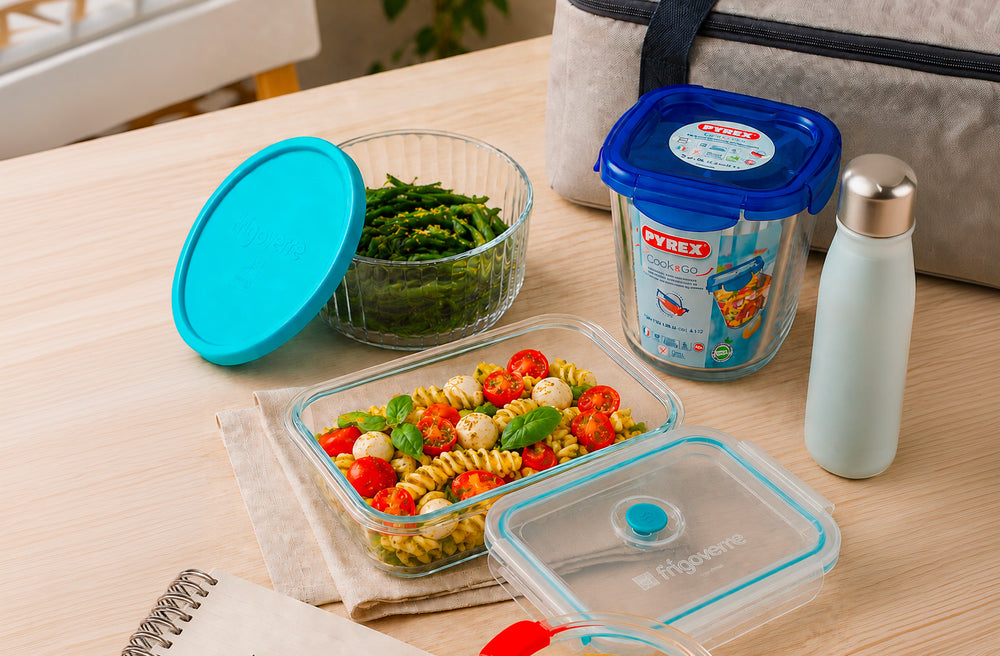 Food containers with salad and fresh ingredients on a table